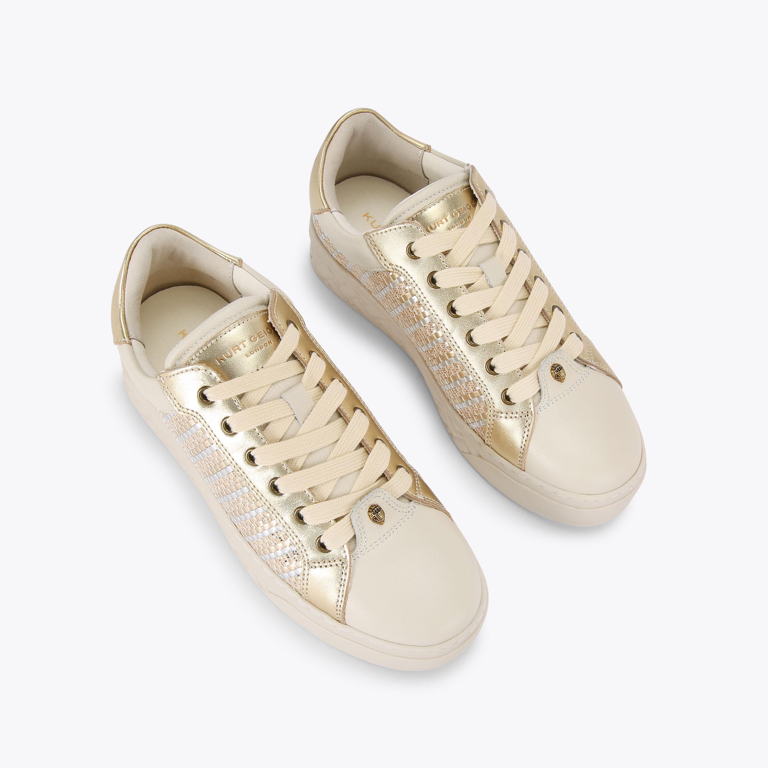 Kurt geiger gold trainers shop