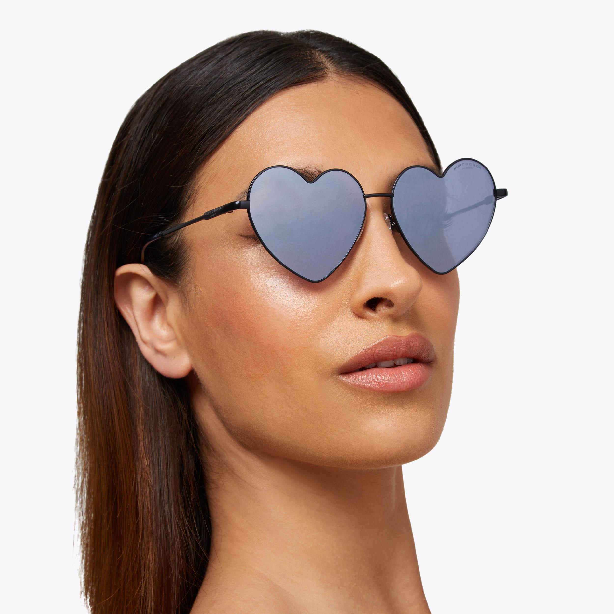 Gold rimmed heart shaped fashion sunglasses